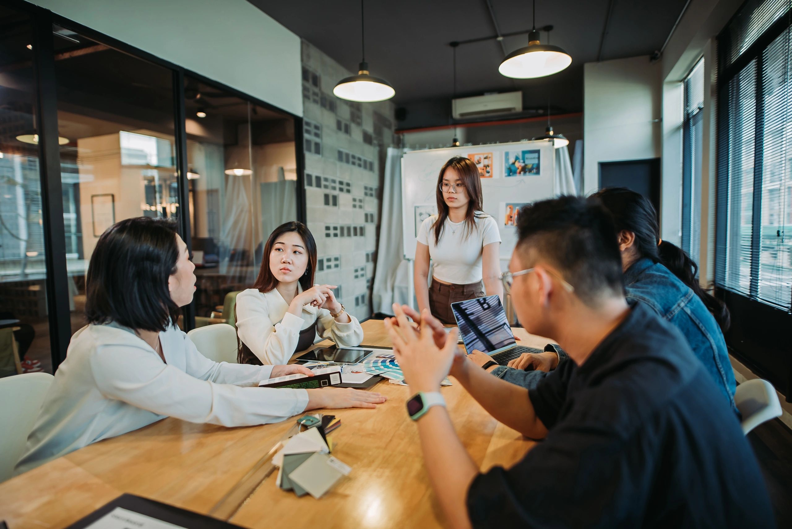 Event planning team collaborating in a studio meeting