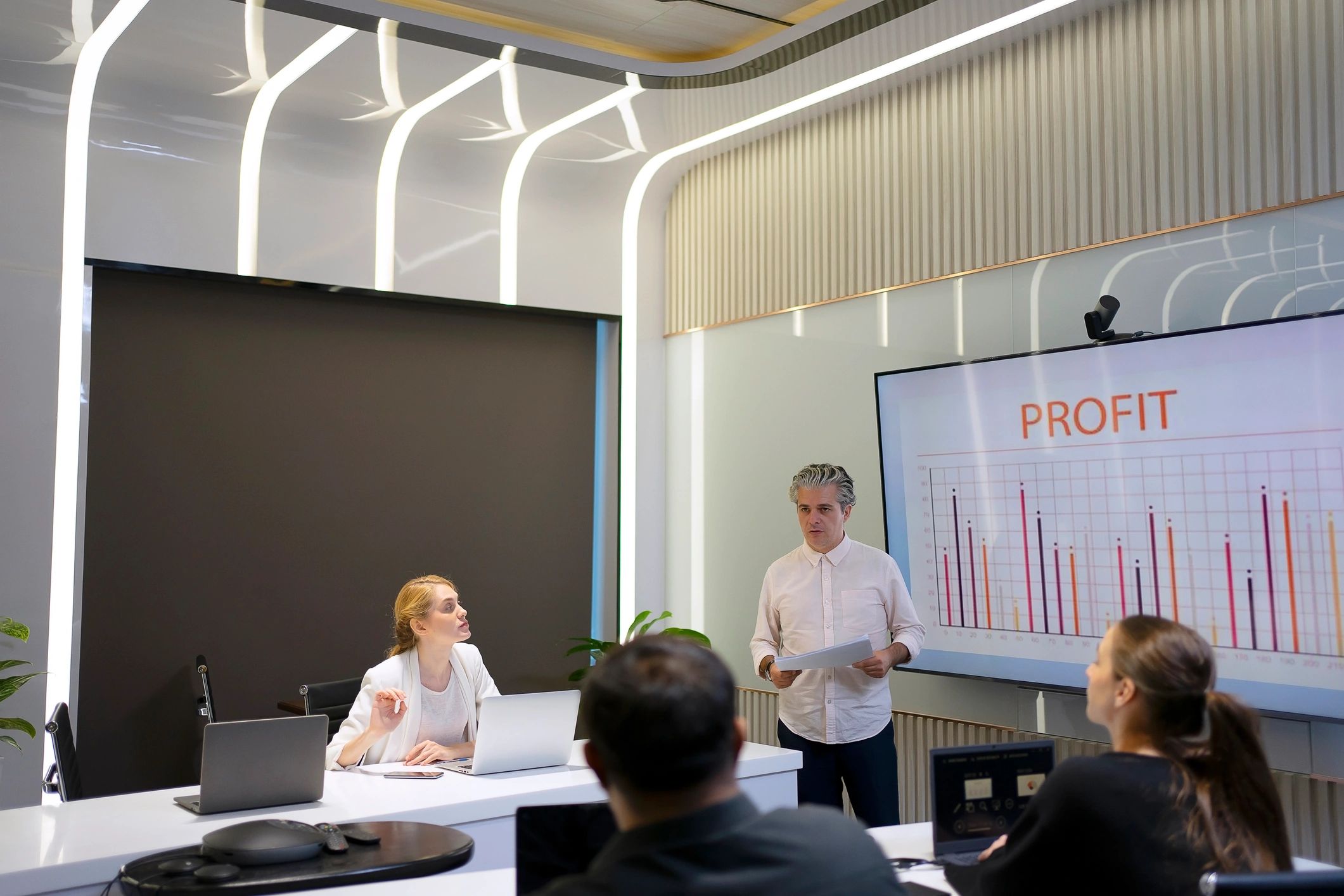 Professional team coordinating event logistics in a meeting room