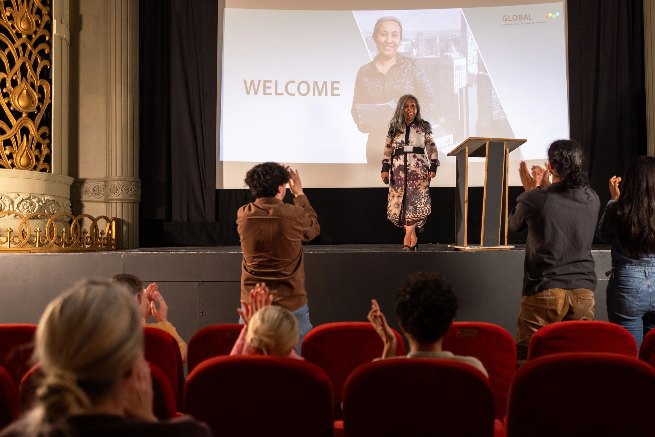 Professional corporate event with speaker and audience